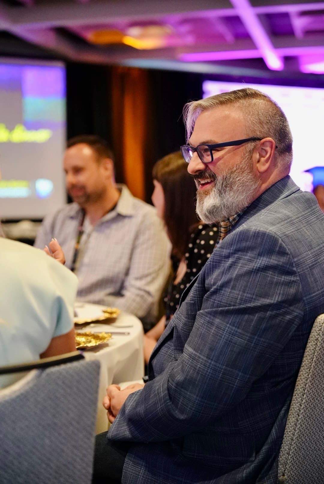 Guests sharing a laugh at a Catalyst-designed event